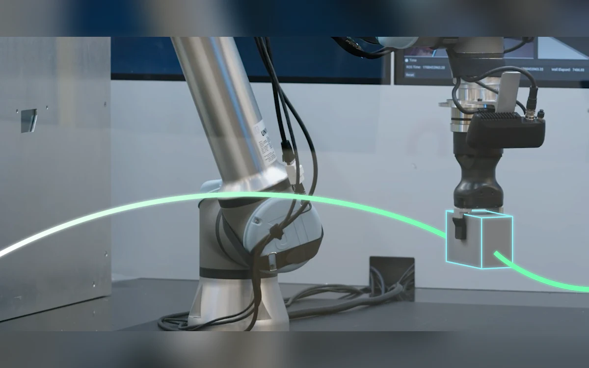 A collaborative robot arm moving a gripped part along a highlighted planned path