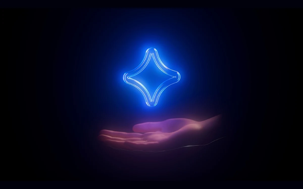 Glowing blue four-point AI sparkle above an open hand on a black background
